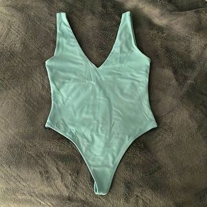 Babaton thong body suit in teal colour, size S, neot